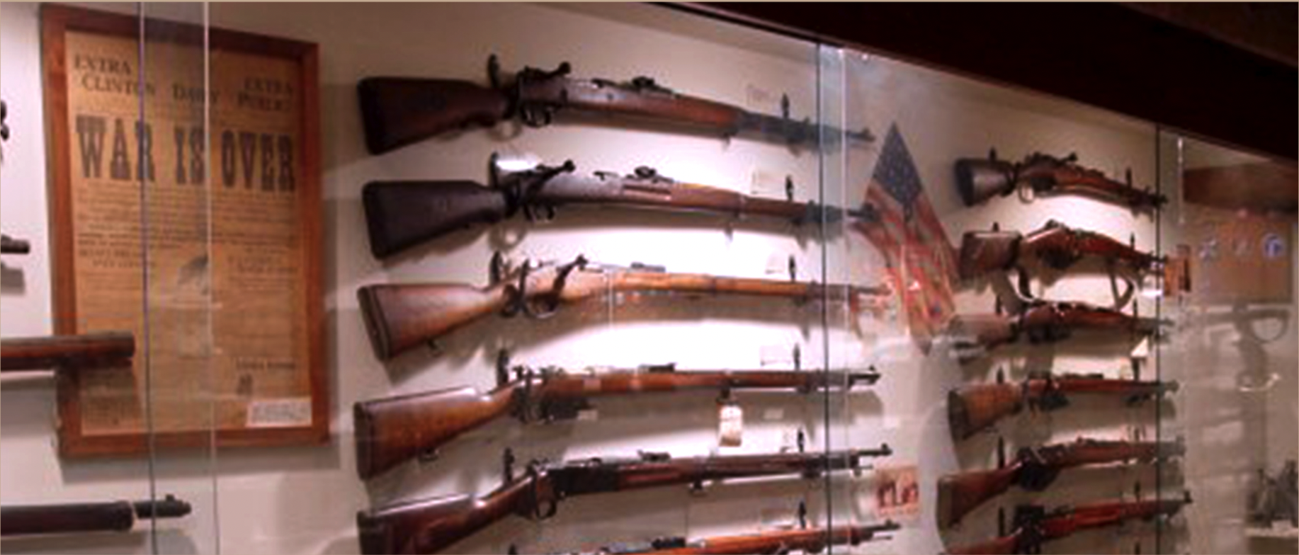 Wall glass case with historical rifles